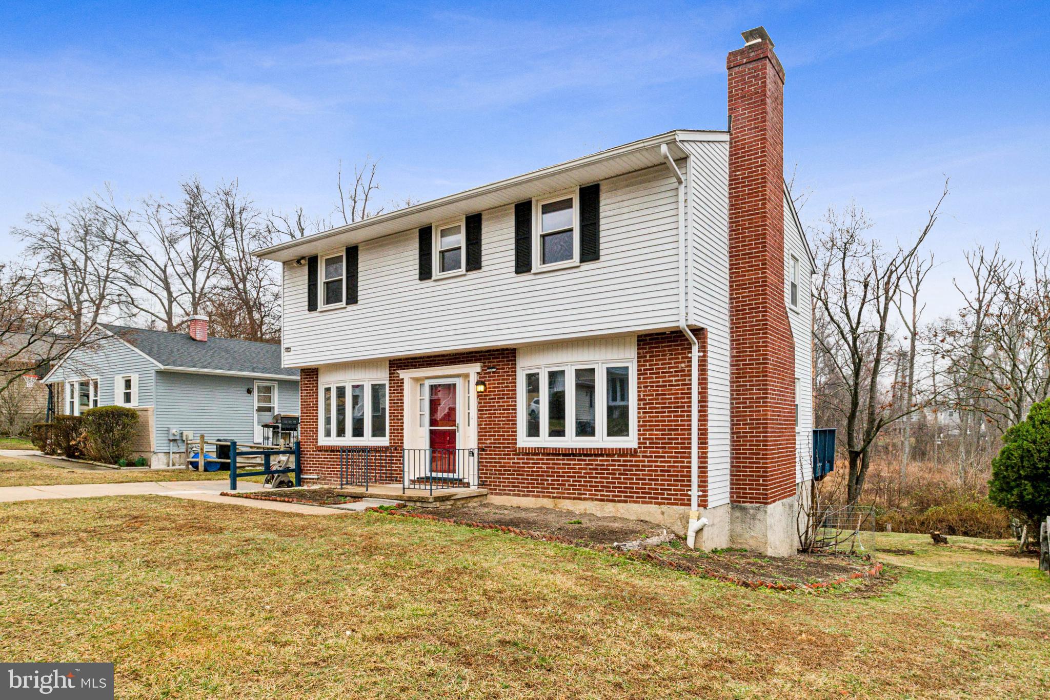 3308 Upton Road Baltimore, MD 21234 - Photo 2 of 44 a front view of a house with a yard