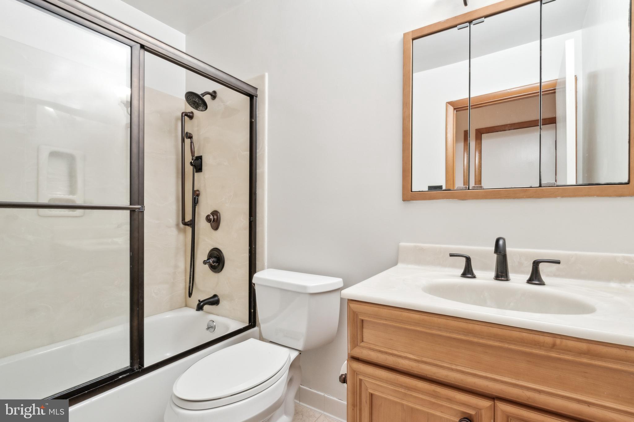 3308 Upton Road Baltimore, MD 21234 - Photo 22 of 44 a bathroom with a sink a toilet and shower