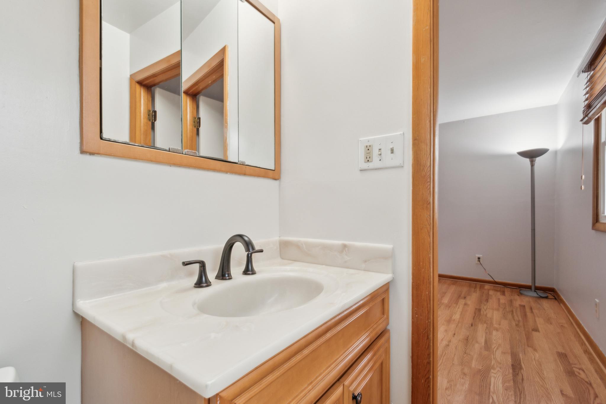 3308 Upton Road Baltimore, MD 21234 - Photo 26 of 44 a bathroom with a sink and a mirror