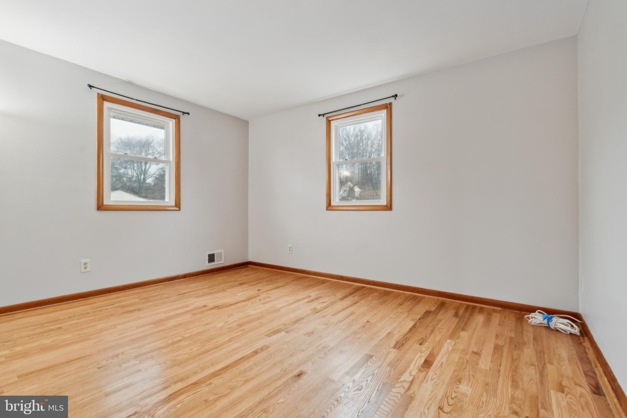 3308 Upton Road Baltimore, MD 21234 - Photo 28 of 44 a view of an empty room with wooden floor and a window