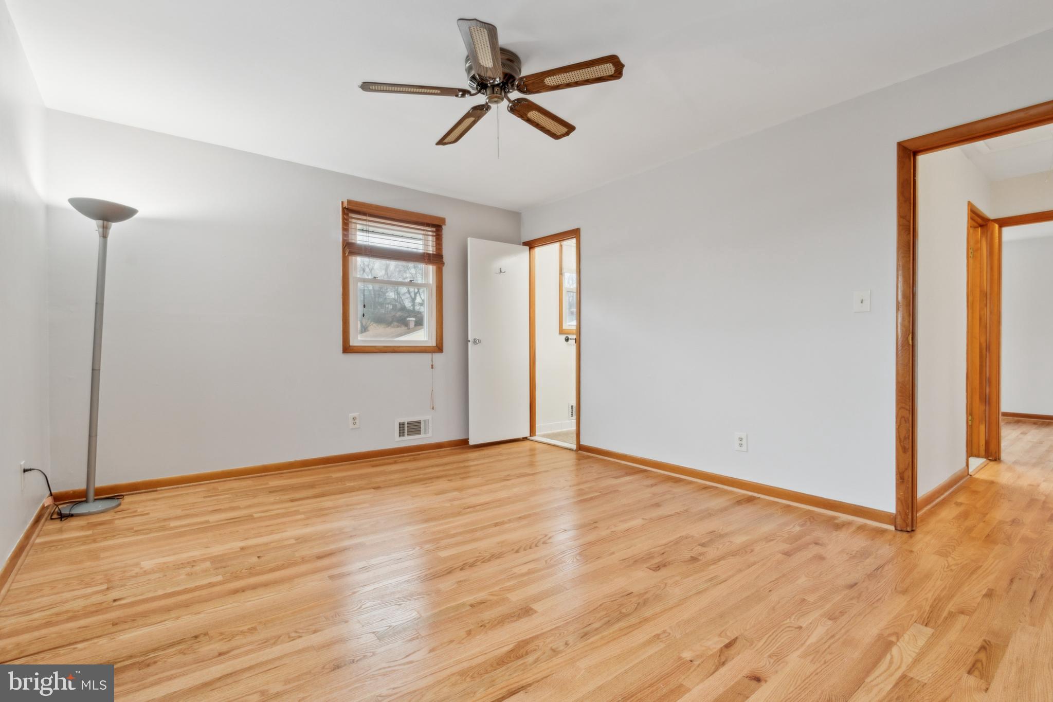 3308 Upton Road Baltimore, MD 21234 - Photo 29 of 44 a view of an empty room with window and wooden floor
