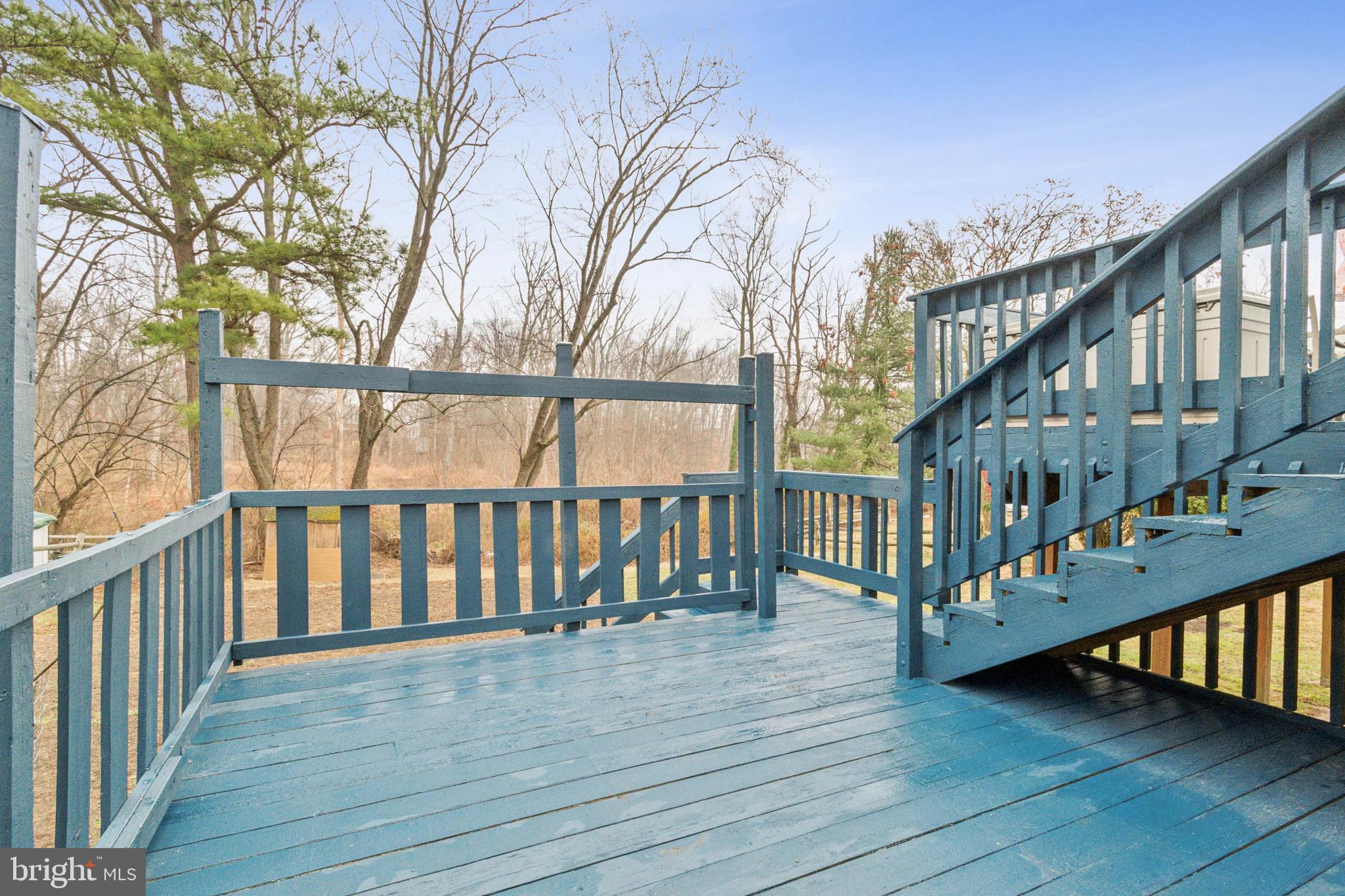 3308 Upton Road Baltimore, MD 21234 - Photo 34 of 44 a view of staircase with lots of frames on wall and wooden floor