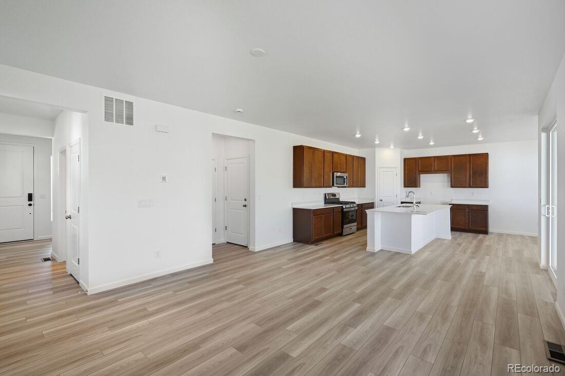 39803 Penn Road Elizabeth, CO 80107 - Photo 12 of 43 a view of kitchen with wooden floor and electronic appliances