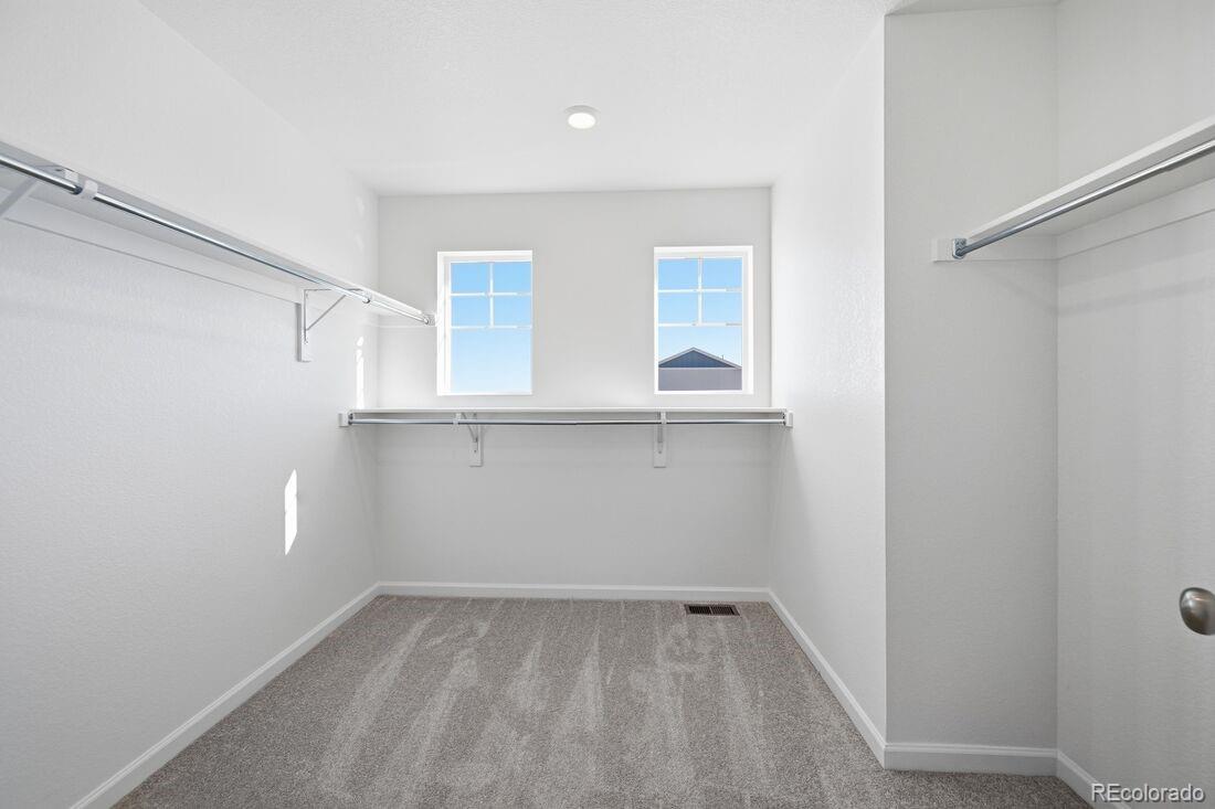 39803 Penn Road Elizabeth, CO 80107 - Photo 18 of 43 wooden floor in an empty room with a window