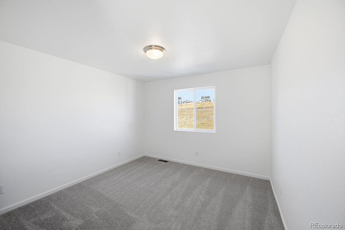 39803 Penn Road Elizabeth, CO 80107 - Photo 23 of 43 an empty room with a window
