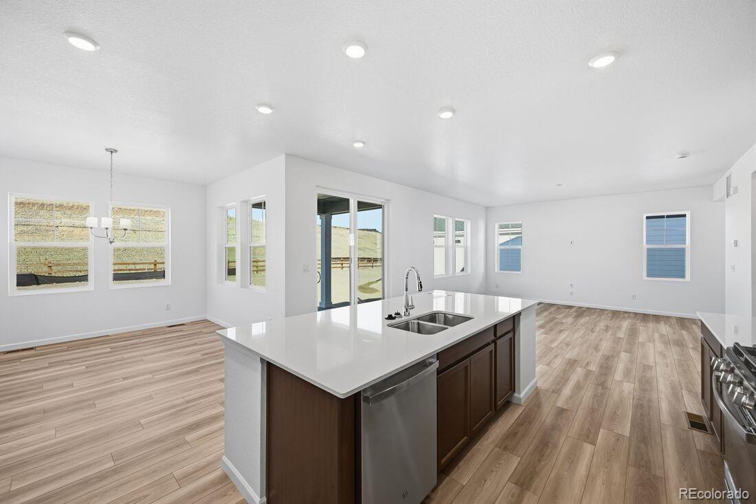39803 Penn Road Elizabeth, CO 80107 - Photo 9 of 43 a kitchen with a sink and wooden floor