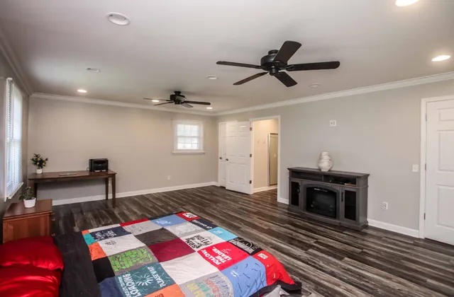 a bedroom with a bed and a fireplace