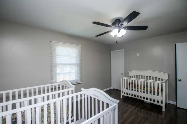 a bedroom with bed and a window