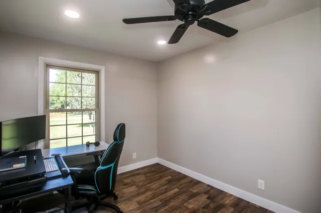 a workspace with furniture and a window