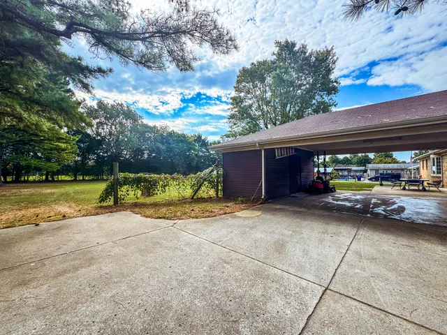a view of a house with entertaining space and a car park view