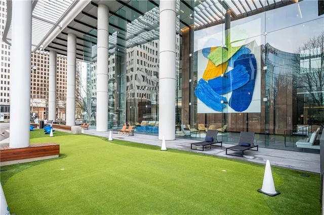 a building outdoor space with glass windows and couches
