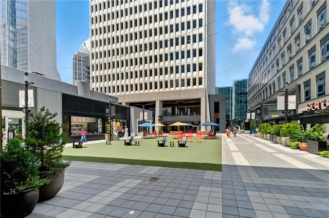 a view of a building with sitting area