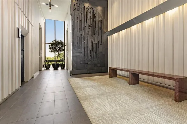 a view of an entryway with wooden walls