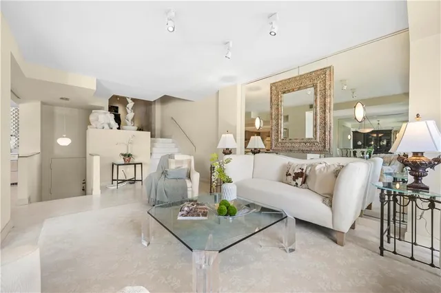 a living room with furniture and a table