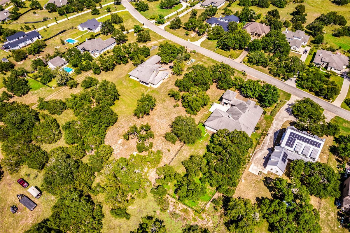 10299 Brangus Road Driftwood, TX 78619 - Photo 12 of 16 Aerial perspective of suburban area