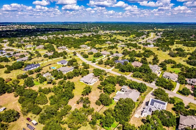 an aerial view of residential house with parking space