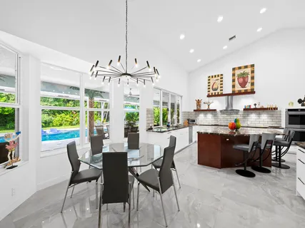 a spacious bedroom with a large bed and a large window