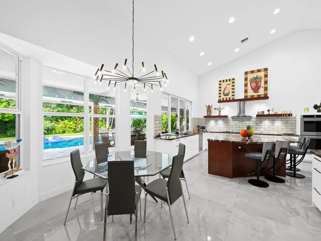 a spacious bedroom with a large bed and a large window