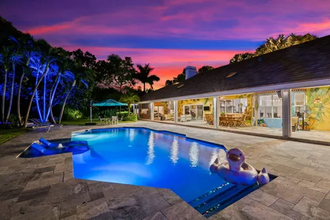 a view of swimming pool with outdoor seating