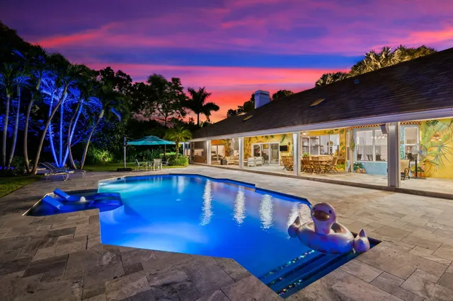 a view of swimming pool with outdoor seating