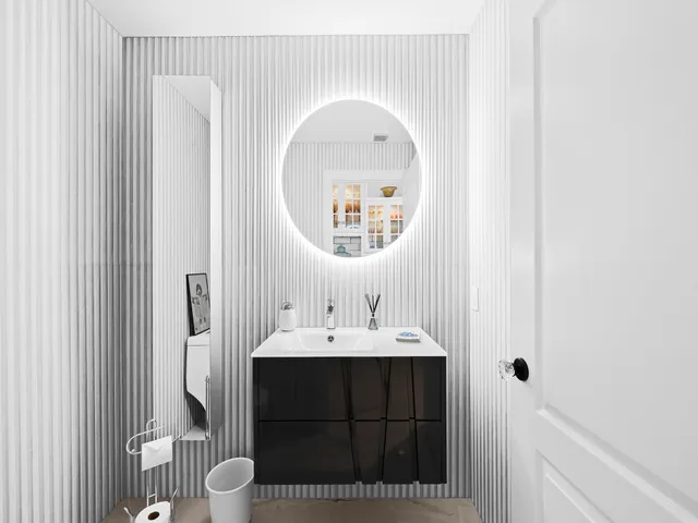 a utility room with cabinets dryer and washer