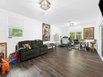 a view of a house with a yard porch and sitting area