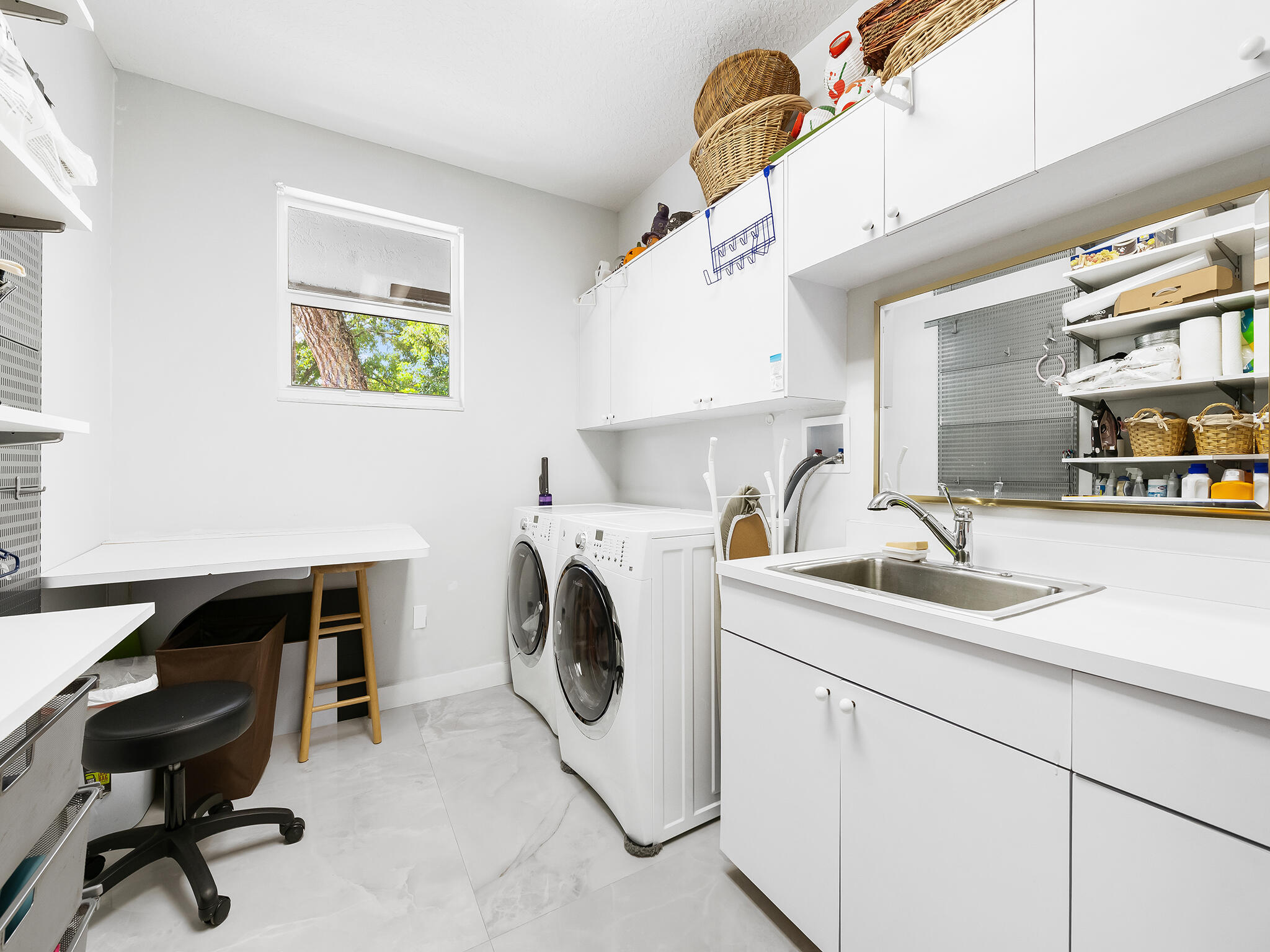 17888 Fieldbrook Circle East Boca Raton, FL 33496 - Photo 35 of 68 a utility room with cabinets dryer and washer