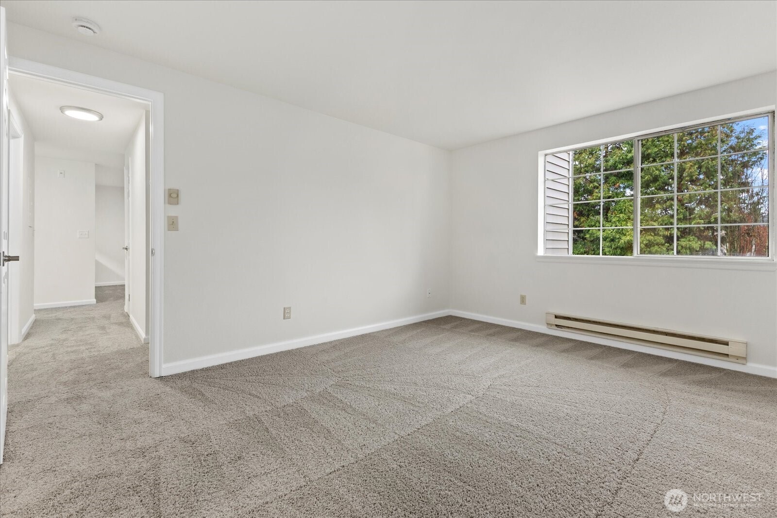 132 Northeast 95th Street, Unit B309 Seattle, WA 98115 - Photo 15 of 24 an empty room with a empty space and windows