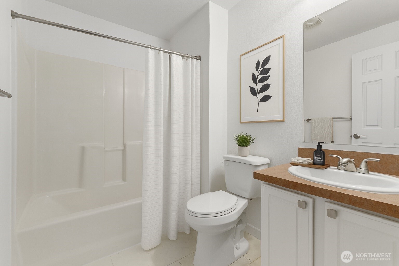 132 Northeast 95th Street, Unit B309 Seattle, WA 98115 - Photo 16 of 24 a bathroom with a sink a toilet and shower