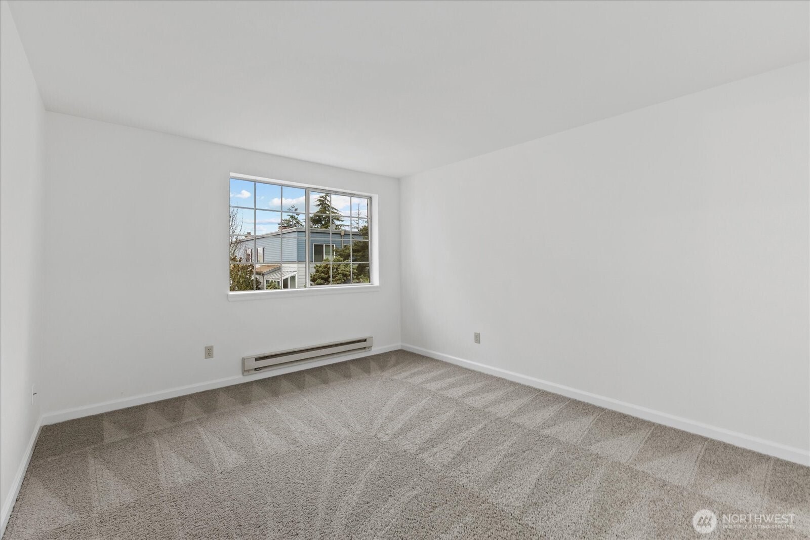 132 Northeast 95th Street, Unit B309 Seattle, WA 98115 - Photo 19 of 24 an empty room with windows