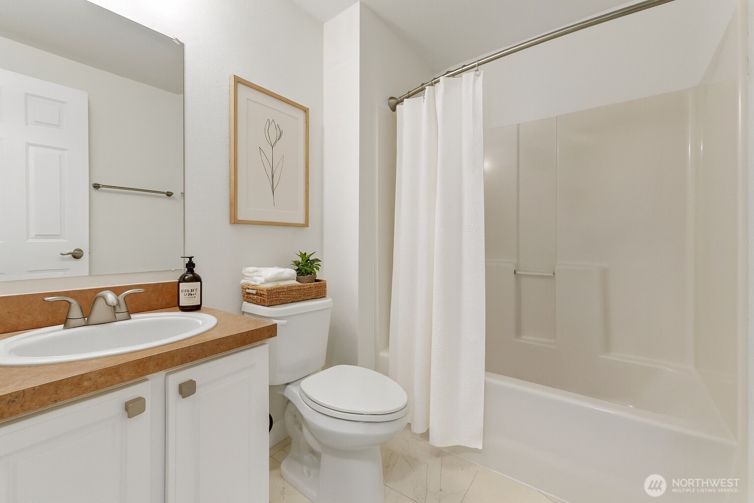 132 Northeast 95th Street, Unit B309 Seattle, WA 98115 - Photo 20 of 24 a bathroom with a sink a toilet and shower