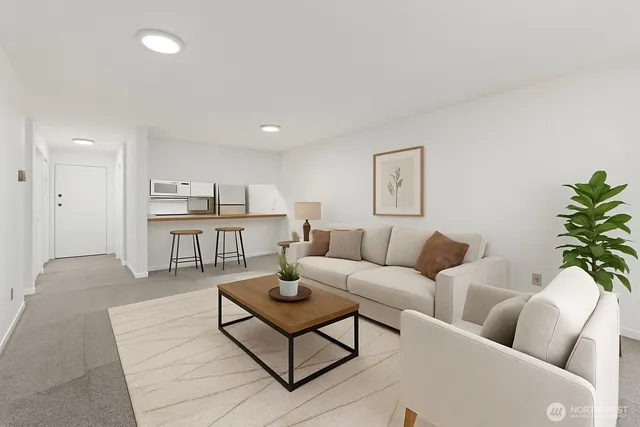 a view of a kitchen with refrigerator and a sink