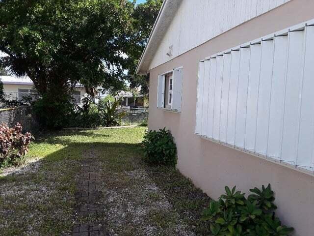 1320 West 26th Court Riviera Beach, FL 33404 - Photo 15 of 17 SIDE WITH SHUTTERS