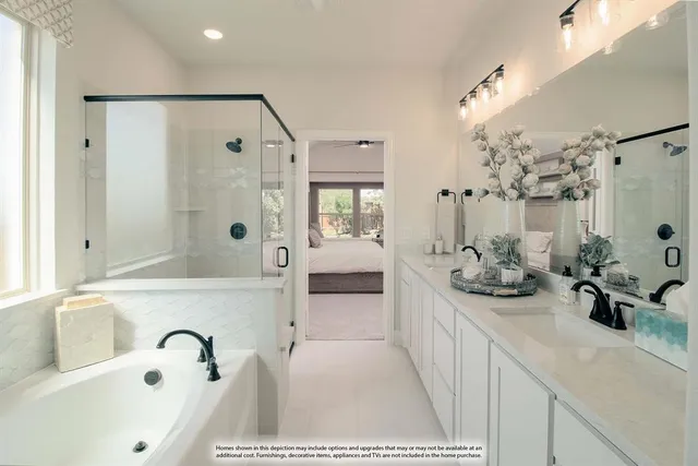 a bathroom with a tub sink and mirror