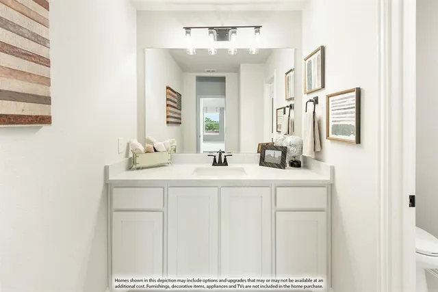 a bedroom with a bed and a large mirror