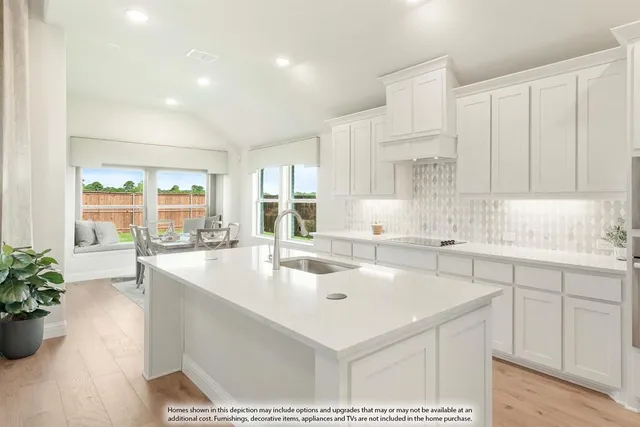 a kitchen with sink cabinets and living room