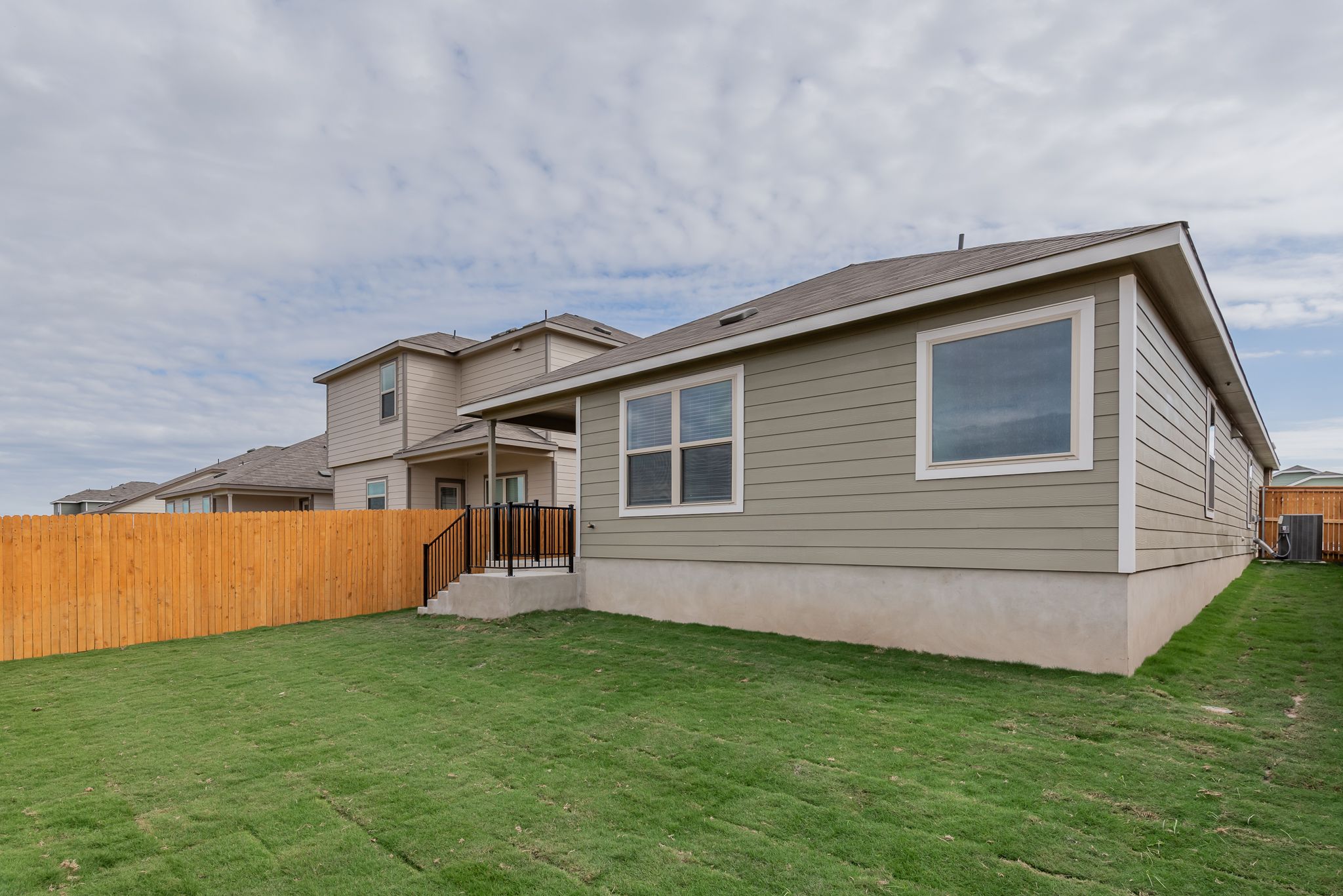509 Greatest Gift Way Jarrell, TX 76537 - Photo 28 of 28 a backyard of a house with lots of green space