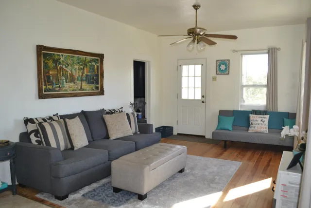 a living room with furniture and a window