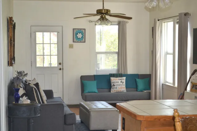 a living room with furniture and a window