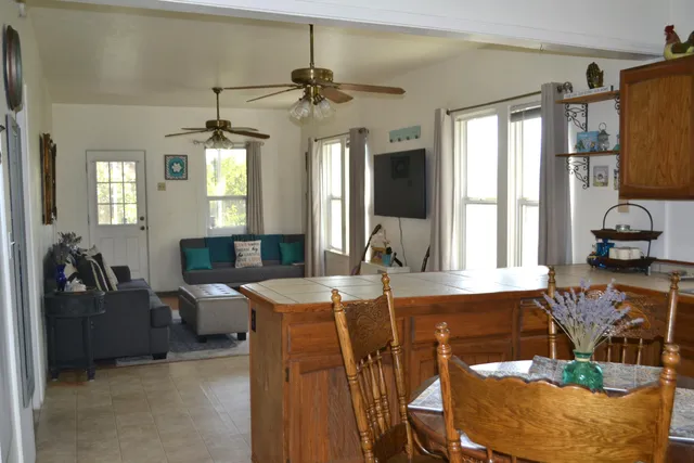 a view of a livingroom with furniture window and wooden floor