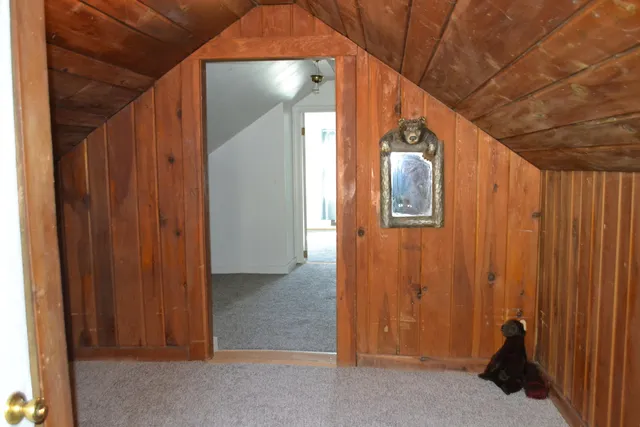 a view of a hallway with entryway door