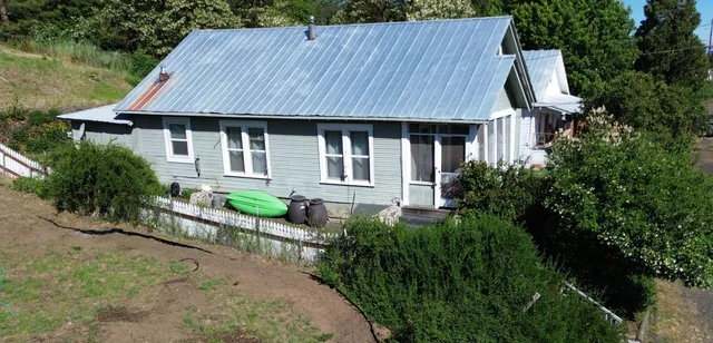 a aerial view of a house with a garden and plants