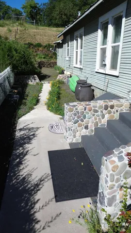 a front view of a house with garden