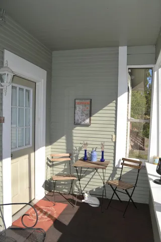 a view of an outdoor sitting area with furniture