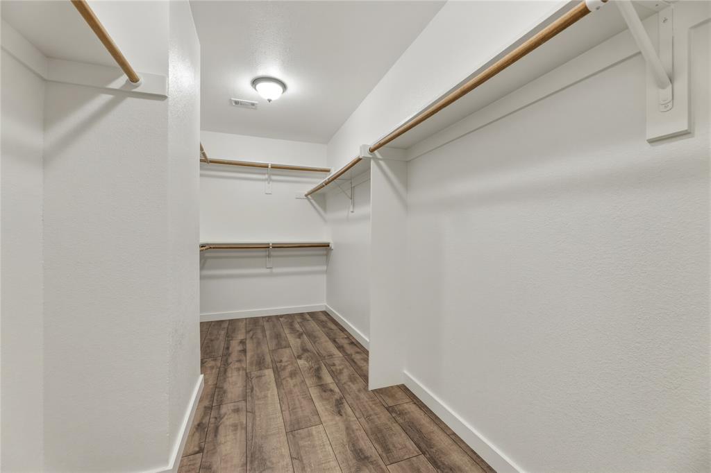 9808 Rockledge Road Fort Worth, TX 76108 - Photo 19 of 30 a view of a room with wooden floor