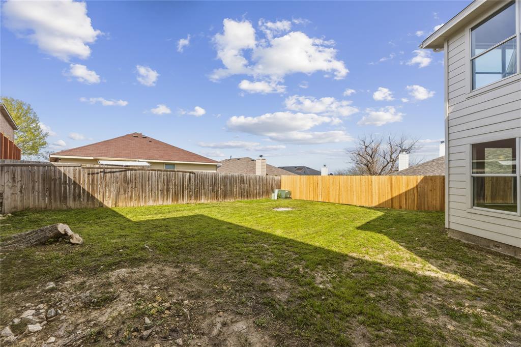 9808 Rockledge Road Fort Worth, TX 76108 - Photo 28 of 30 a view of a house with a backyard