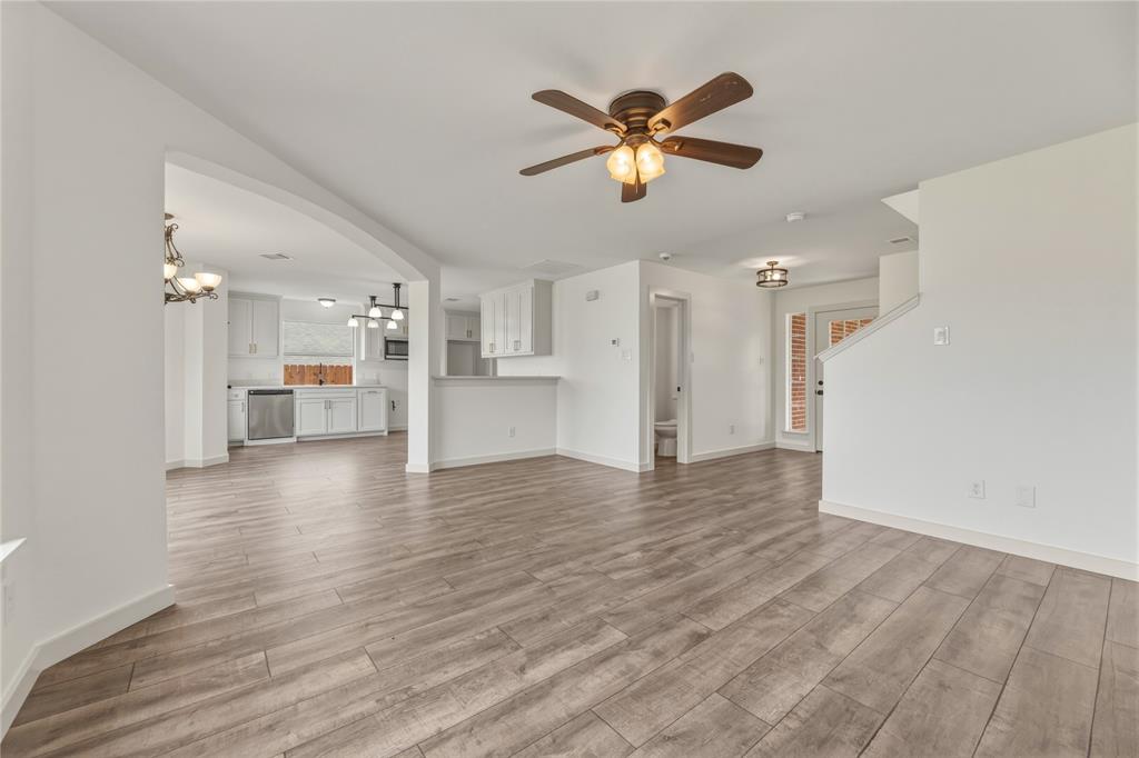 9808 Rockledge Road Fort Worth, TX 76108 - Photo 5 of 30 a view of empty room with wooden floor and window
