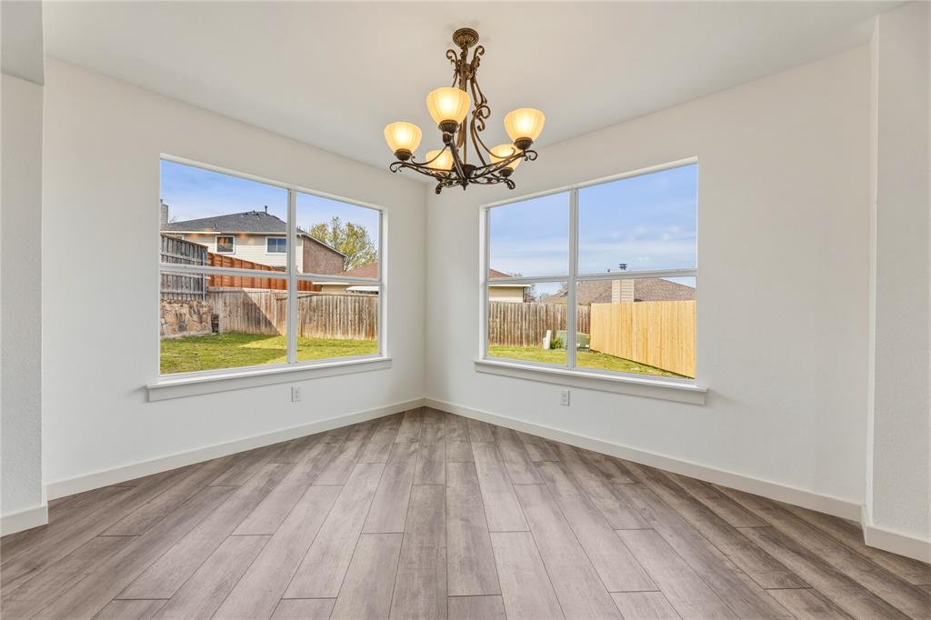 9808 Rockledge Road Fort Worth, TX 76108 - Photo 8 of 30 a view of an empty room with a window