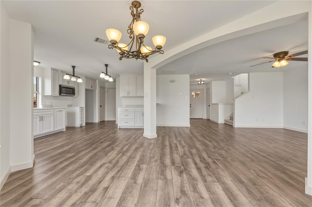 9808 Rockledge Road Fort Worth, TX 76108 - Photo 9 of 30 a view of a livingroom with a chandelier furniture and a chandelier