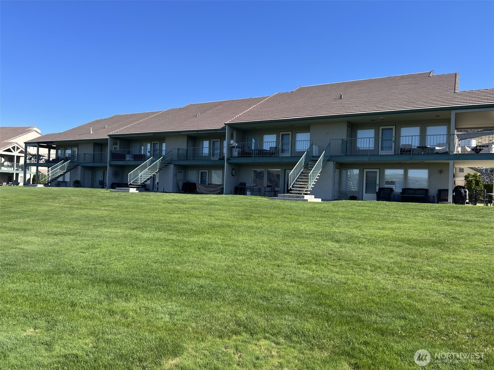 8997 Crescent Bar Road Northwest, Unit C118 Quincy, WA 98848 - Photo 2 of 33 a house view with a garden space